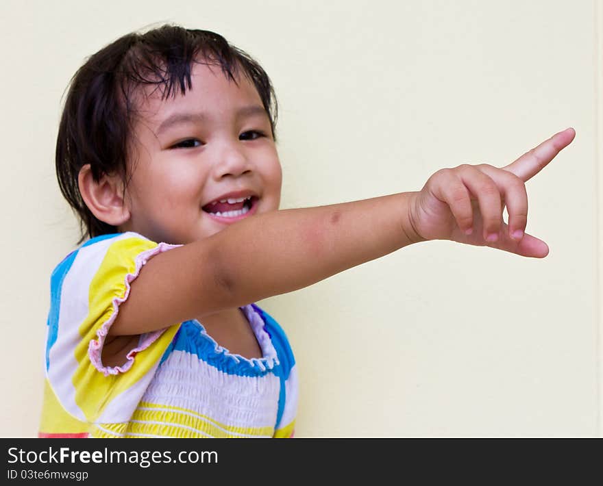 Thai child pointing.