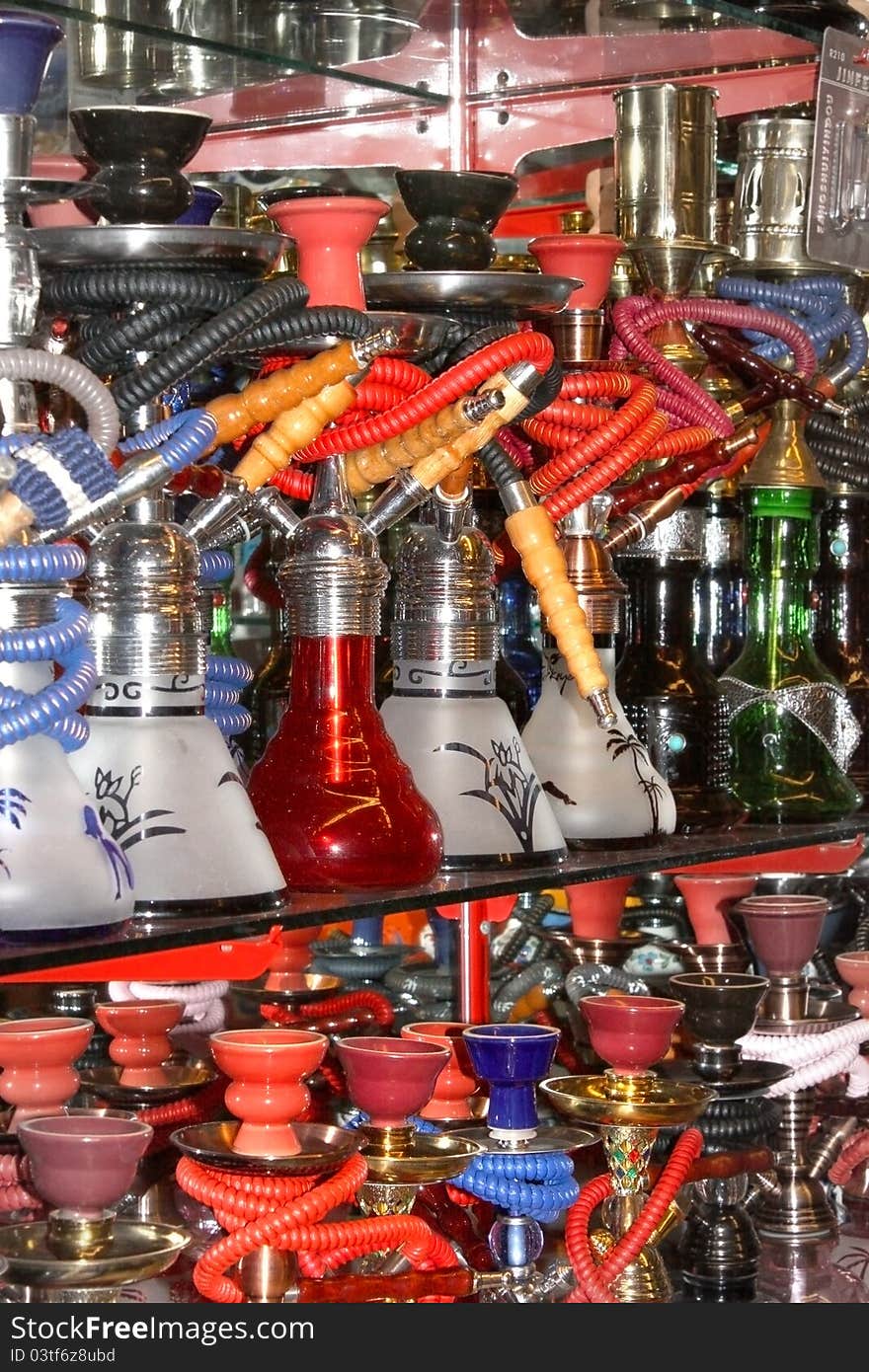 Different colorful arabic hookahs in the eastern market. Different colorful arabic hookahs in the eastern market.