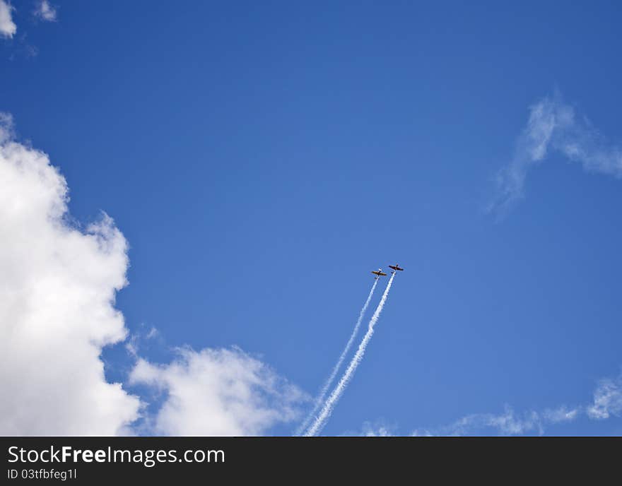 Acrobatics with two planes through the clouds. Acrobatics with two planes through the clouds