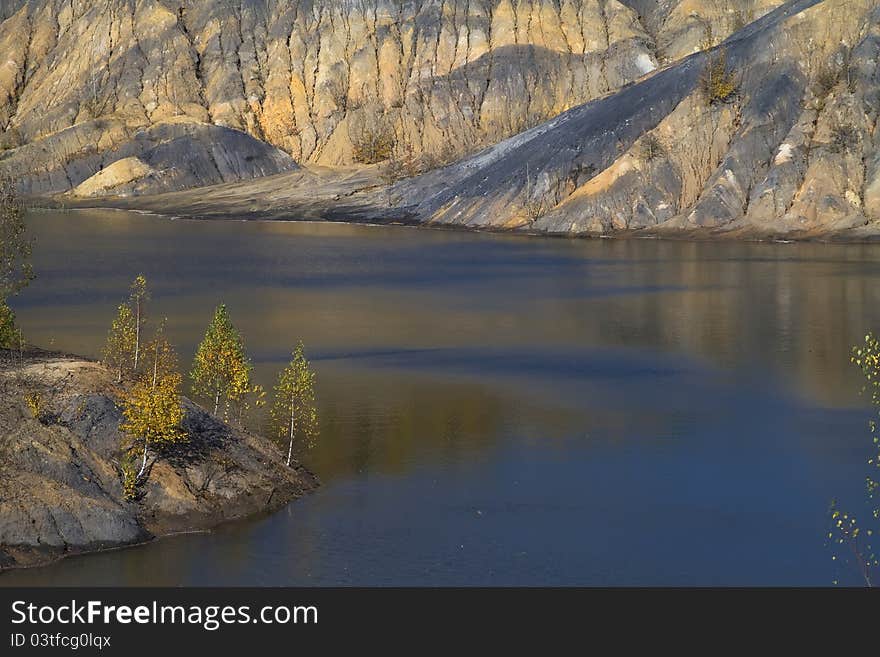 Yellow autumn birches and a lake