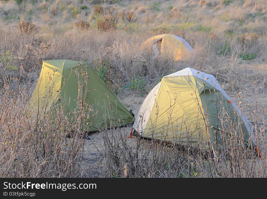 Photo of camping tents on site in nature