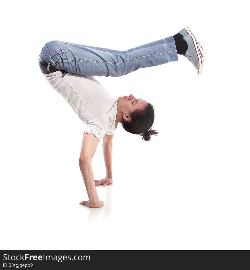 Hip-hop style dancer posing over white background. Hip-hop style dancer posing over white background