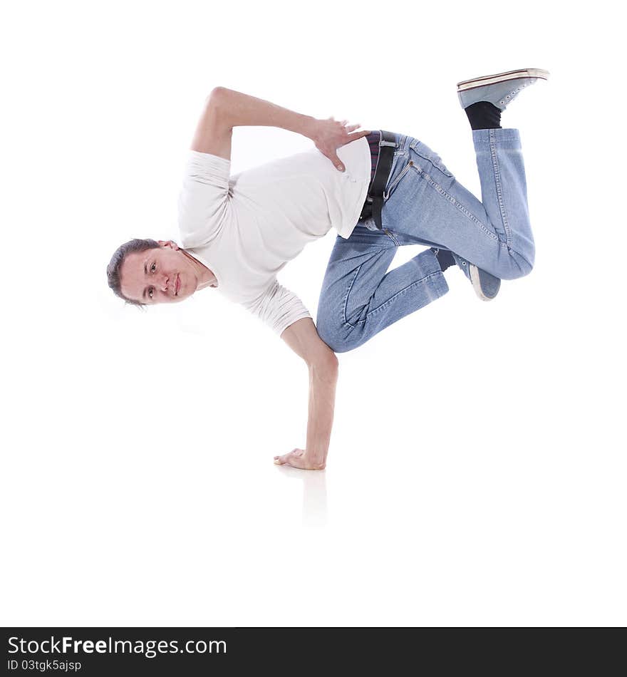 Hip-hop style dancer posing over white background. Hip-hop style dancer posing over white background