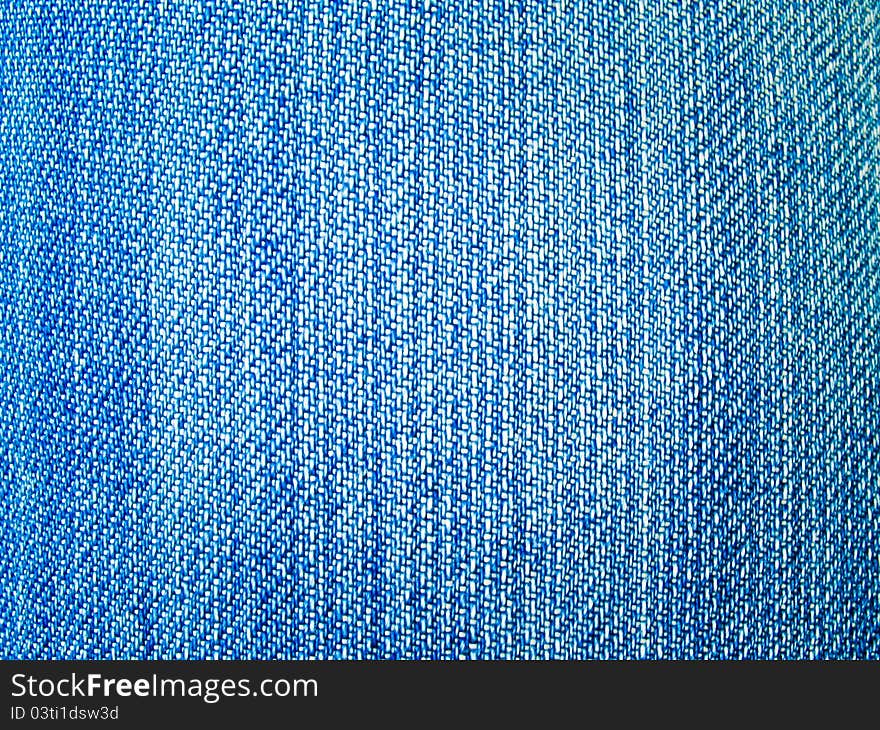 Background of dark blue jeans fabric