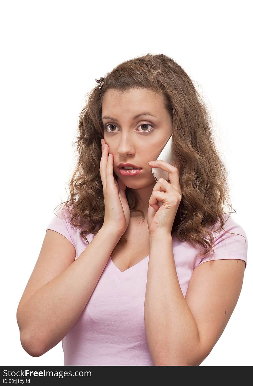 A distressed young woman on the phone isolated.