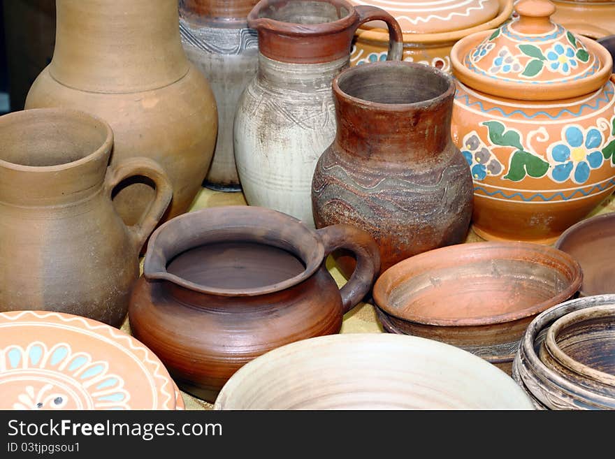 Pots in the window of a potter's workshop, a traditional pottery. Pots in the window of a potter's workshop, a traditional pottery