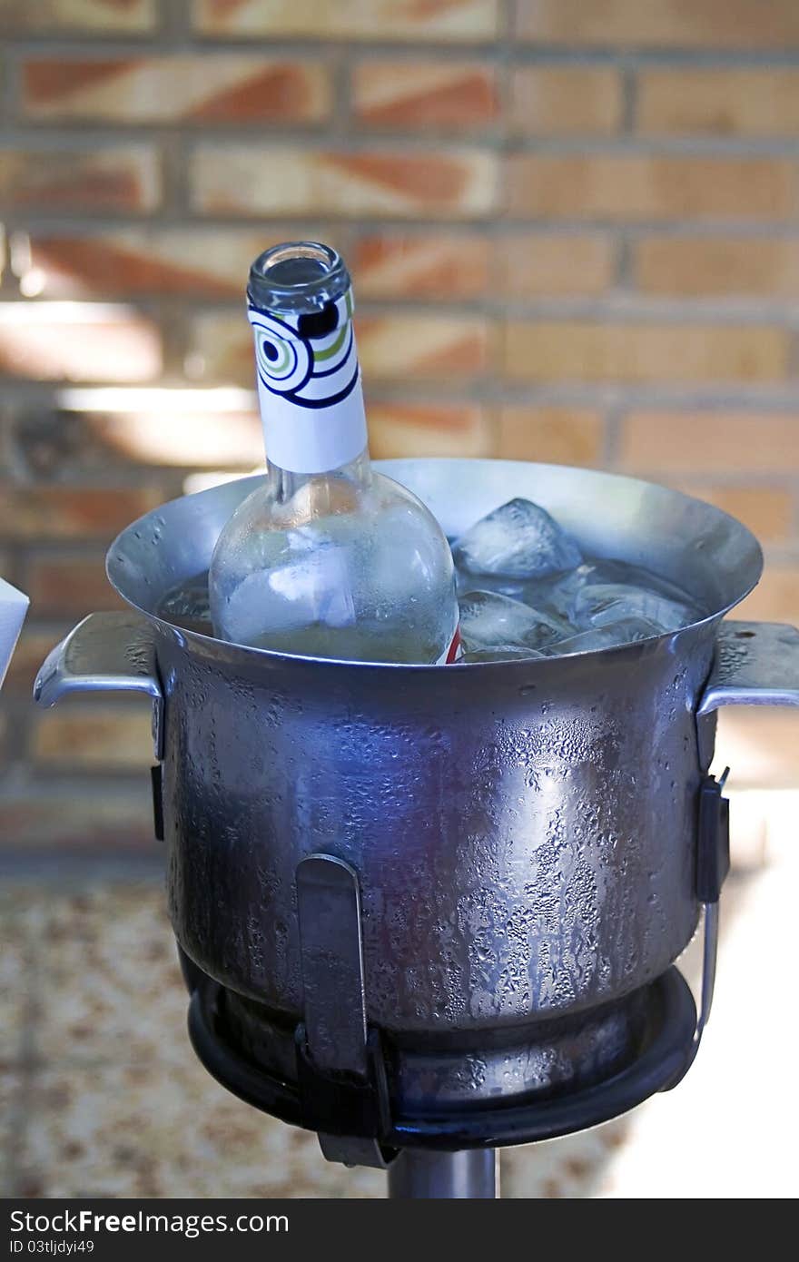 Close up view of a bottle of wine in a bucket. Close up view of a bottle of wine in a bucket