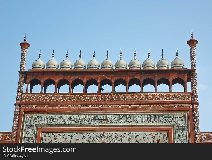 The close up of gate to Taj Mahal in Agra in the Uttar Pradesh region of India. It is a one of New Seven Wonders of the World. The close up of gate to Taj Mahal in Agra in the Uttar Pradesh region of India. It is a one of New Seven Wonders of the World.