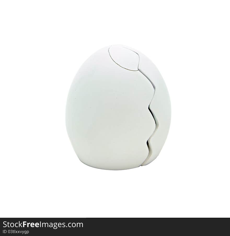 Isolated cracking egg on white for easter holiday celebration