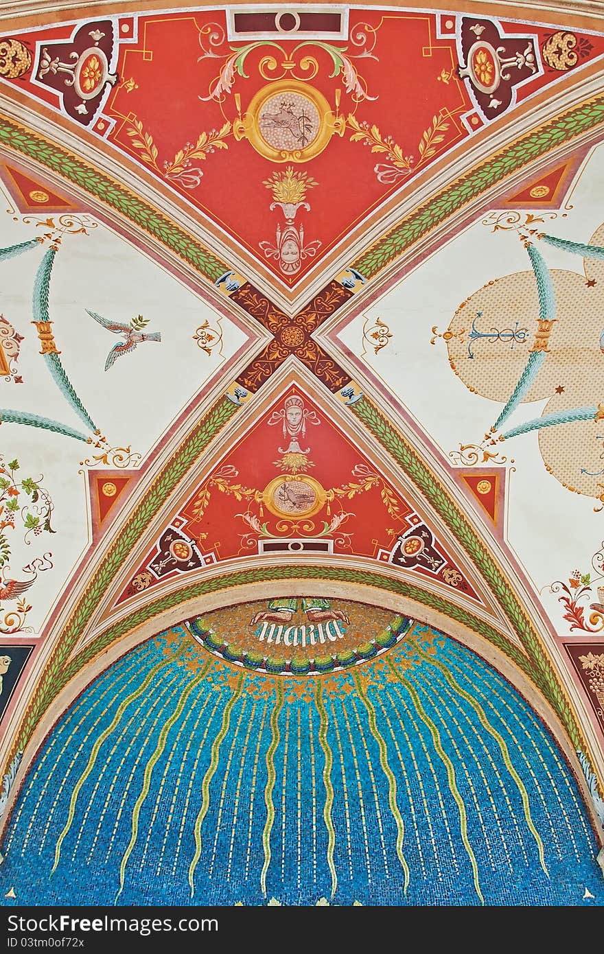 Old colorful ceiling with a blue mosaic of stones.