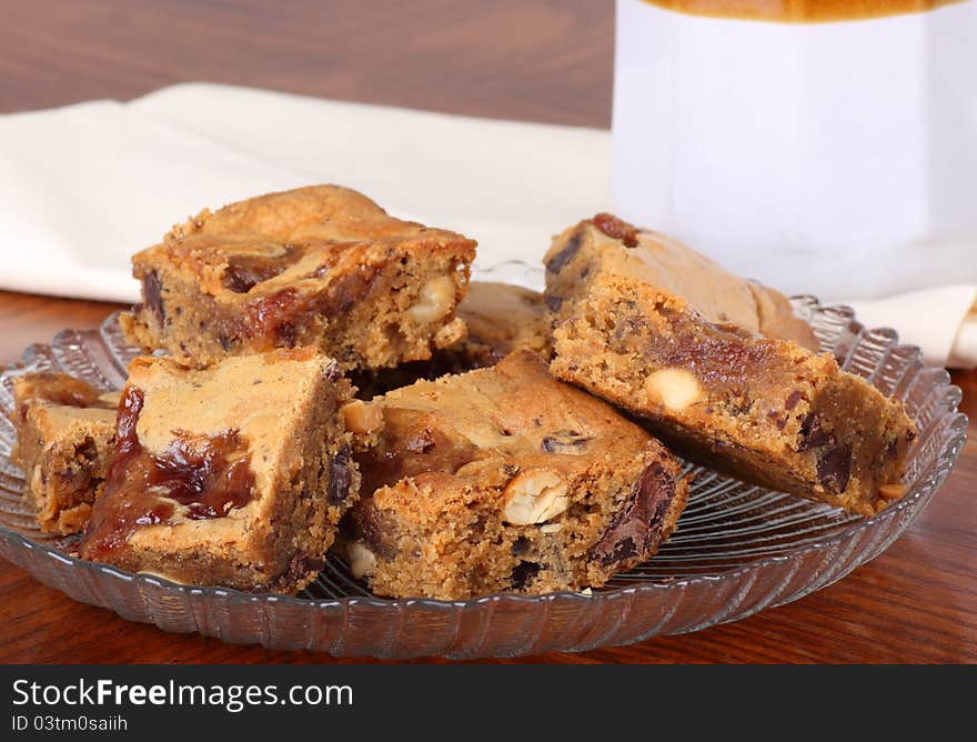 Glass plate of nutty peanut butter squares