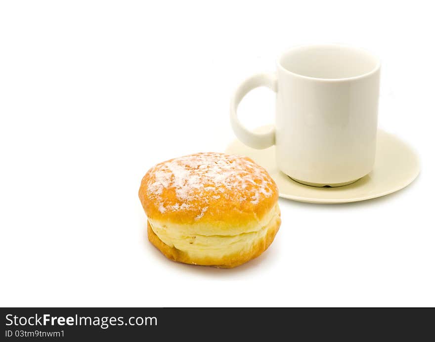 A cup of tea and a chocolate donut isolated on white