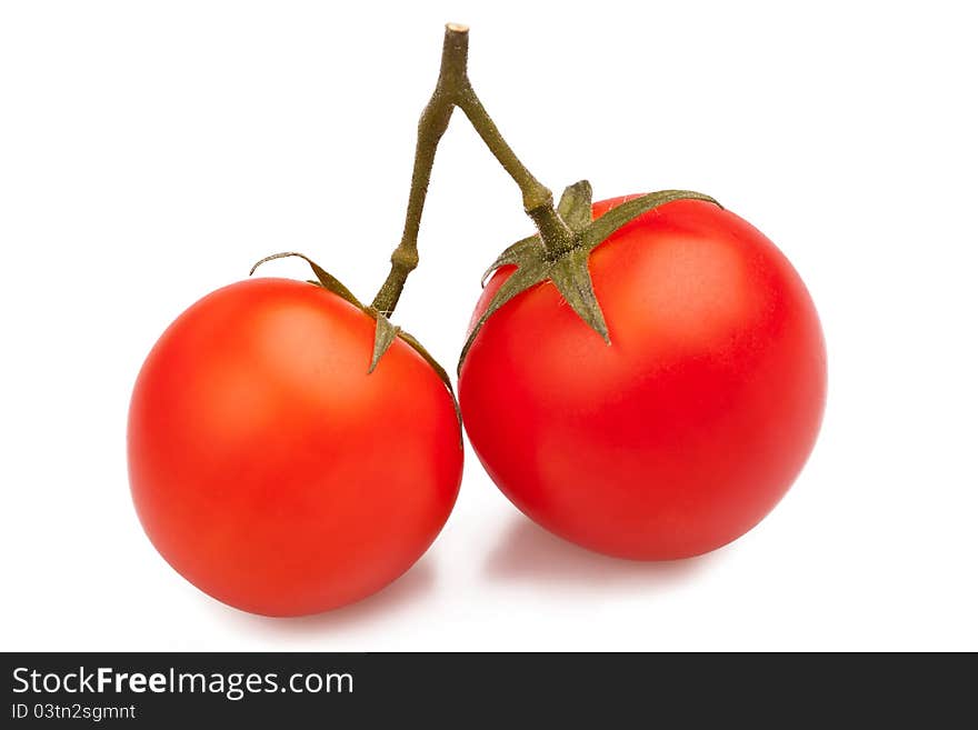 Two red tomatoes on white background