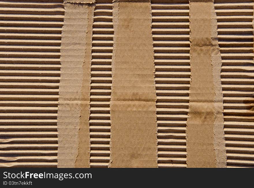 Paper box background. Fragment of packing box wall. Backdrop. Wallpaper. Paper box background. Fragment of packing box wall. Backdrop. Wallpaper.