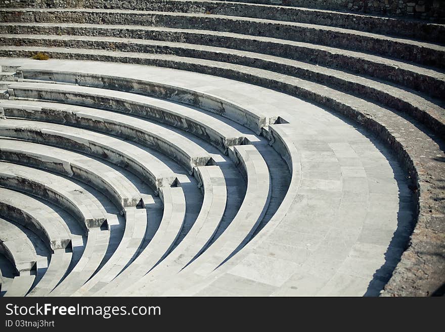 Old curved stairs of ancient greek amphitheater. Old curved stairs of ancient greek amphitheater