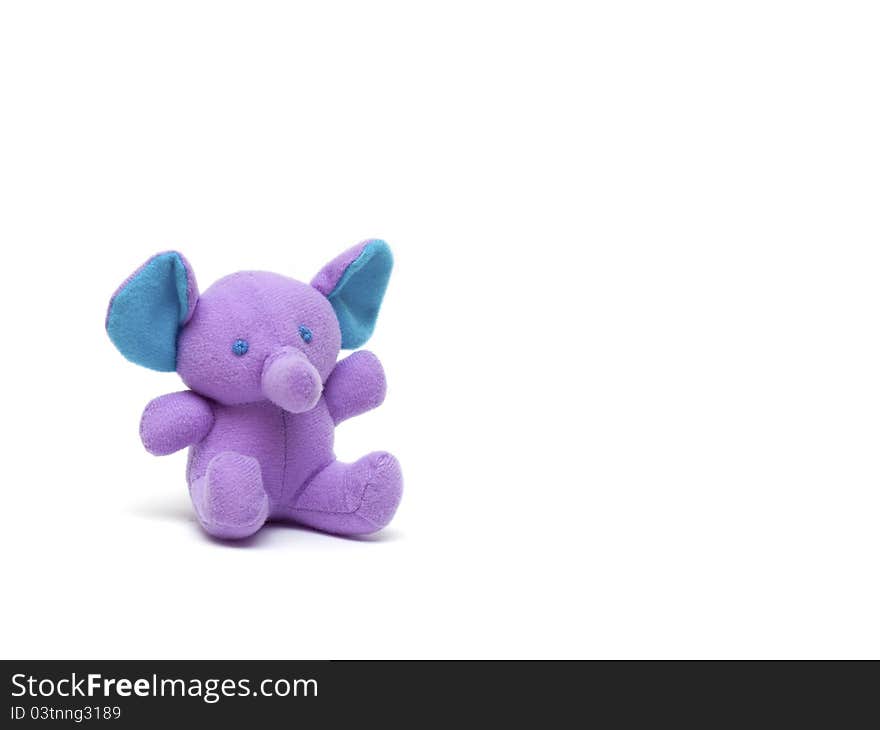 Purple toy elephant on a white background