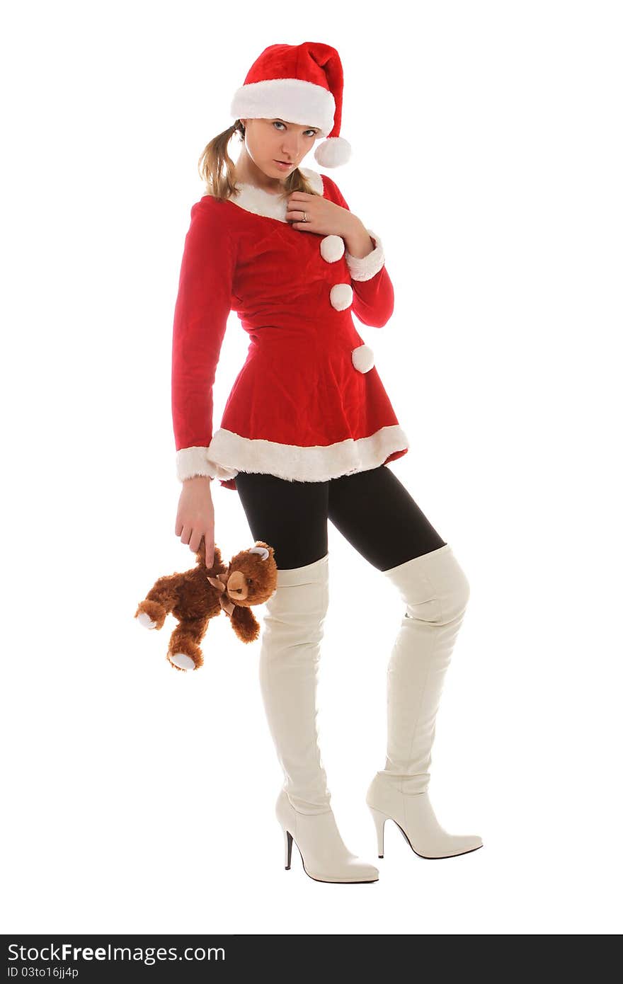 Santa's helper in tall white boots holding a toy. Santa's helper in tall white boots holding a toy