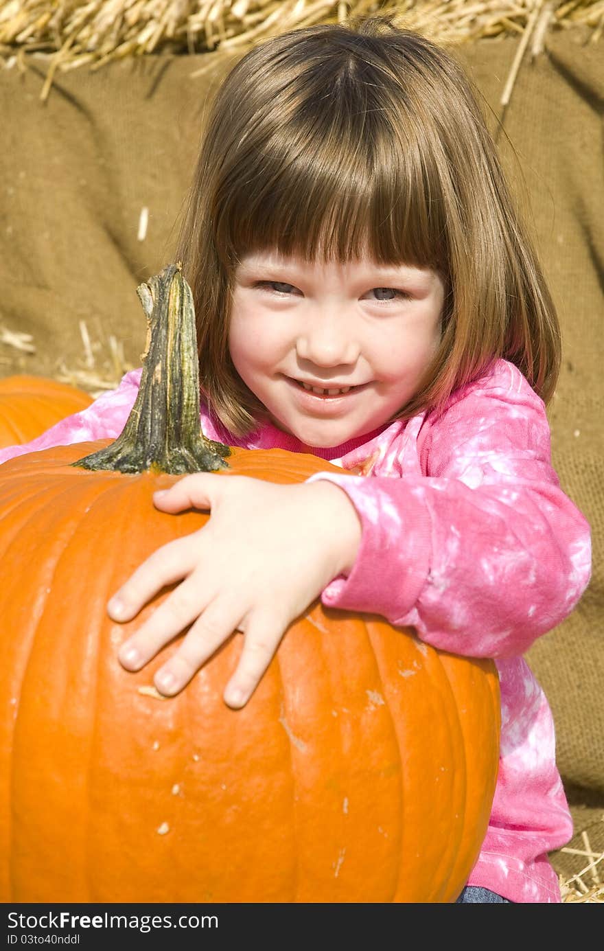 Little Girl With Pumpkins