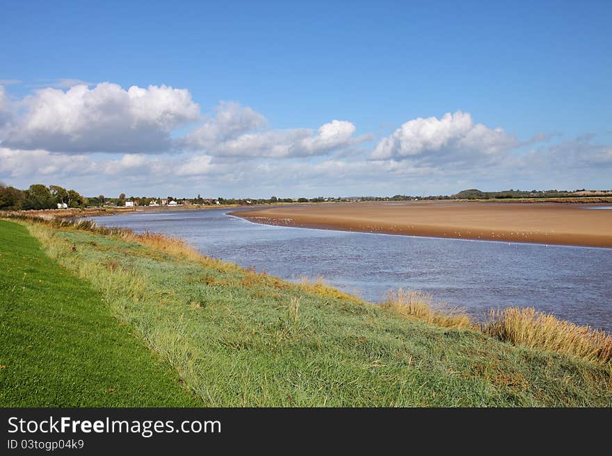 Low Tide on the River Severn in England with stormy clouds in the sky. Low Tide on the River Severn in England with stormy clouds in the sky