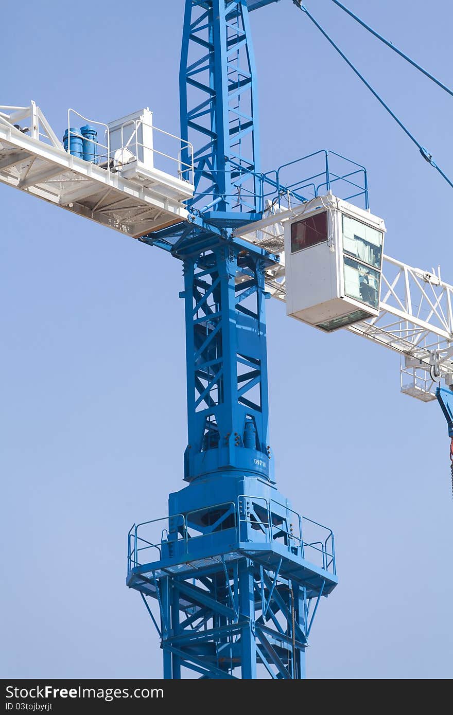 Crane on a blue sky background. Crane on a blue sky background