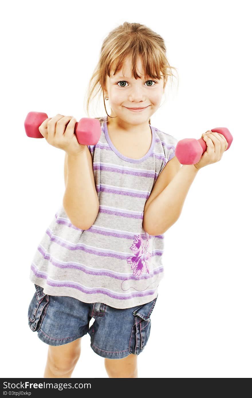 Happy little girl lifting dumbbells smiling cheerful. Isolated on white background. Happy little girl lifting dumbbells smiling cheerful. Isolated on white background