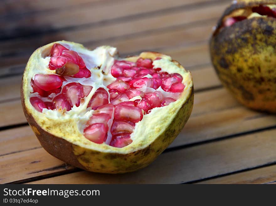 A picture of pomegranate splited in half fruit