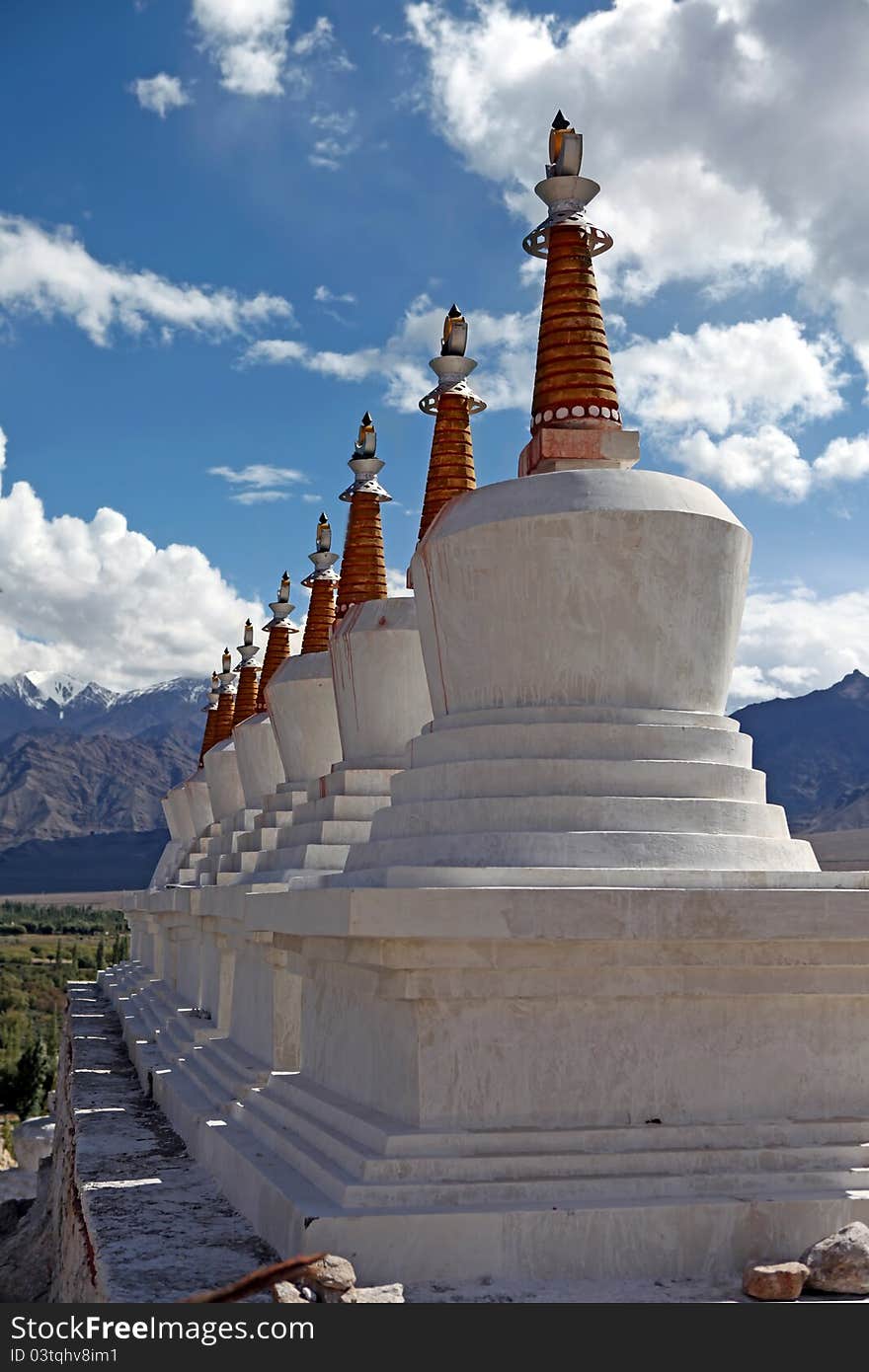 Landscape with a row of Stupas and green valley of the mountain background. Himalaya. Landscape with a row of Stupas and green valley of the mountain background. Himalaya