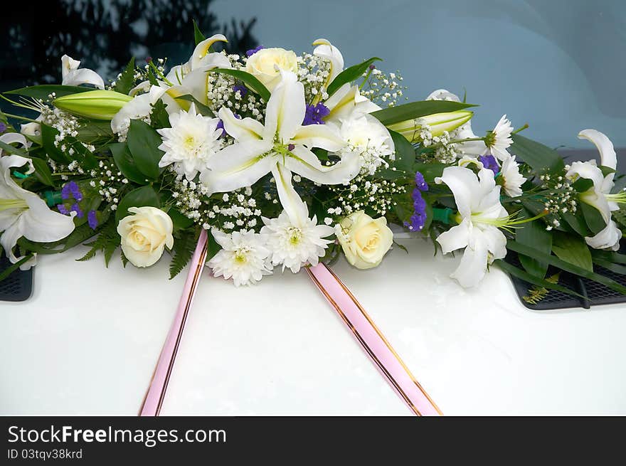 Wedding car decorated with a beautifull flowers. Wedding car decorated with a beautifull flowers