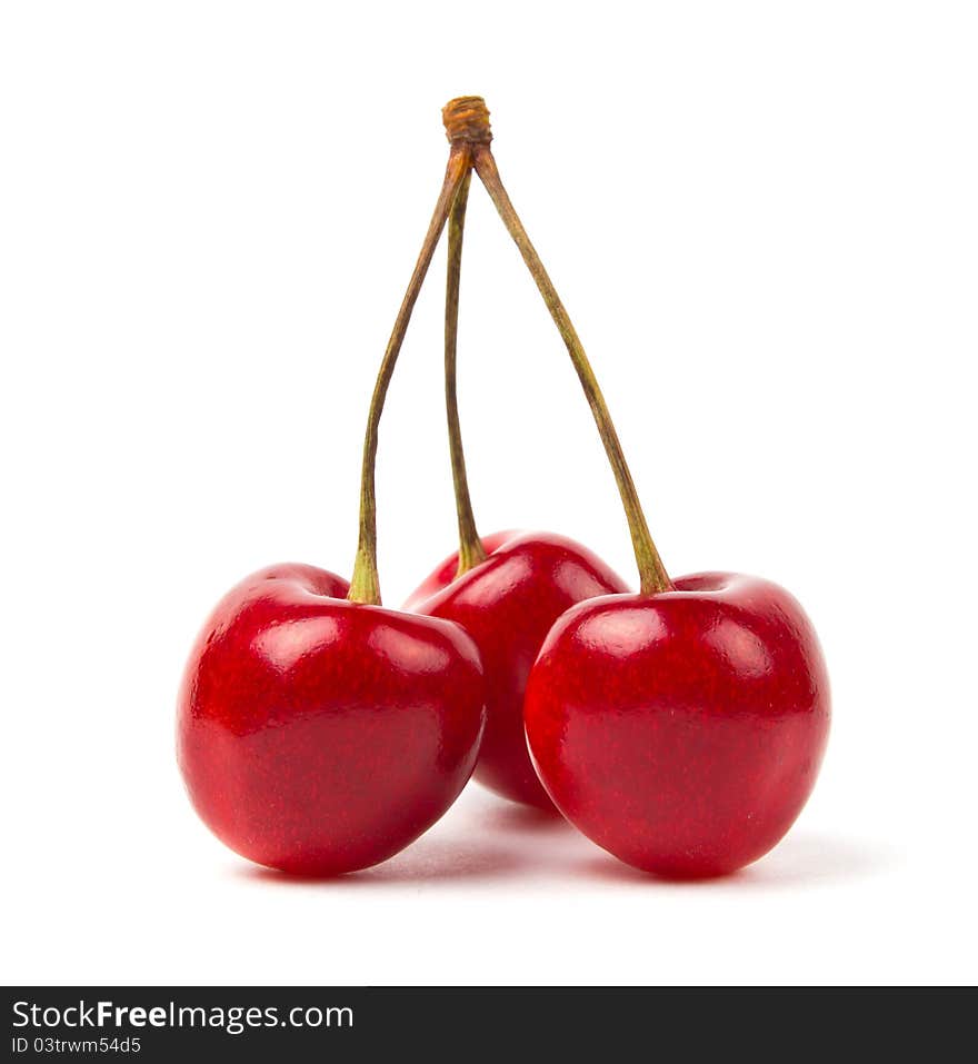 Ripe red cherries on a white background. Ripe red cherries on a white background