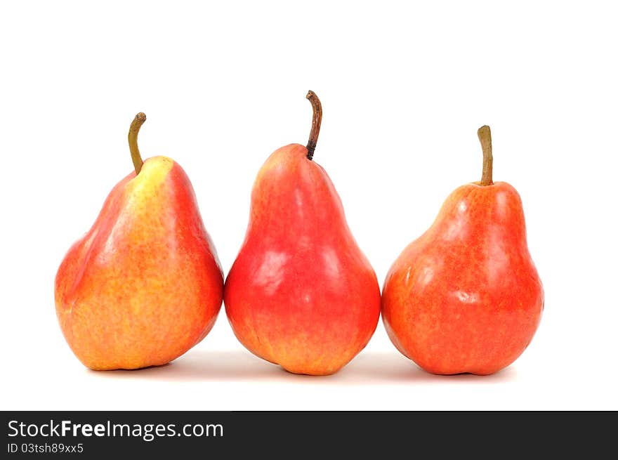 Fresh red pears on a white background, close up. Fresh red pears on a white background, close up