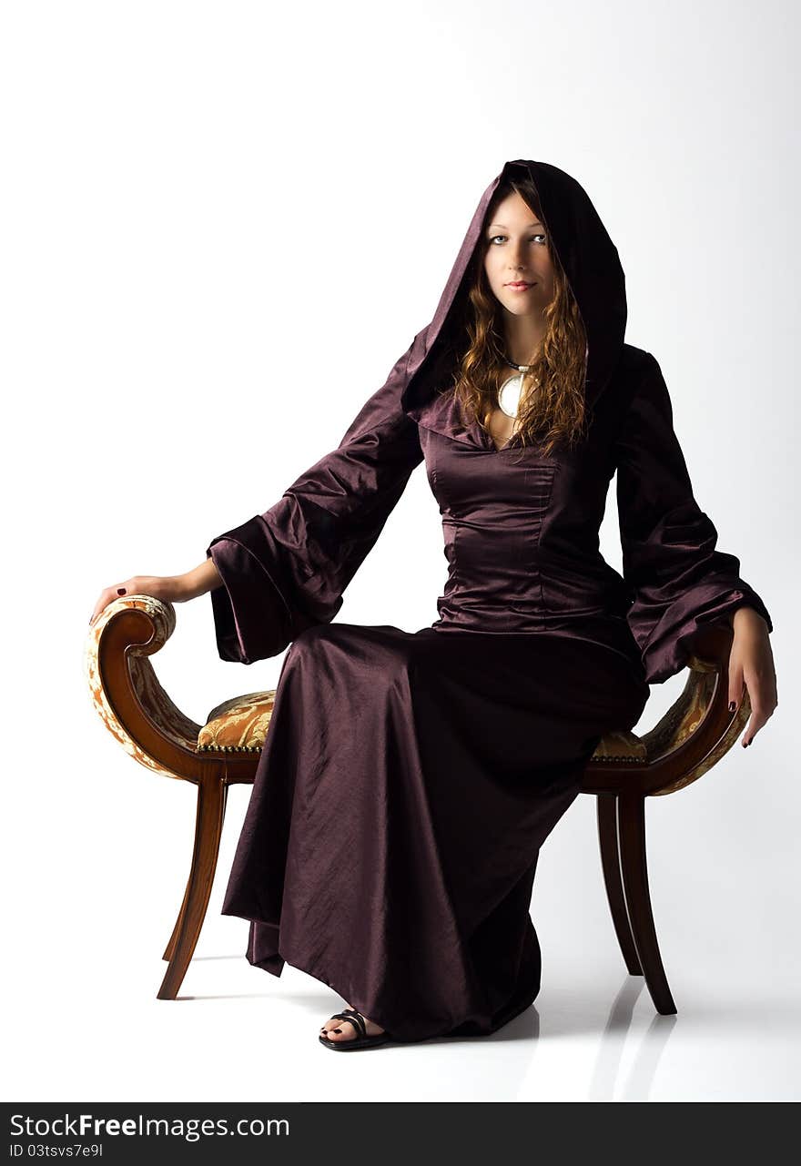 Girl posing sitting in studio