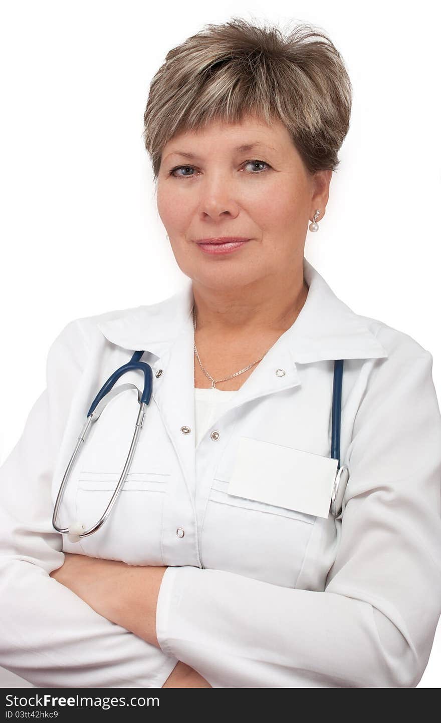 Woman doctor standing with hands crossed