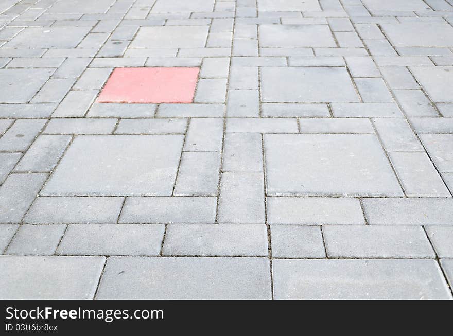 Abstract design of a cobblestone sidewalk.