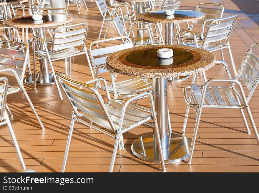 Tables with ashtrays in outdoor bar