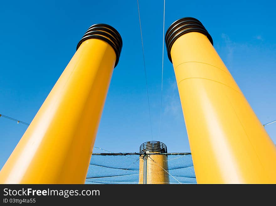 Three yellow funnels of cruise liner