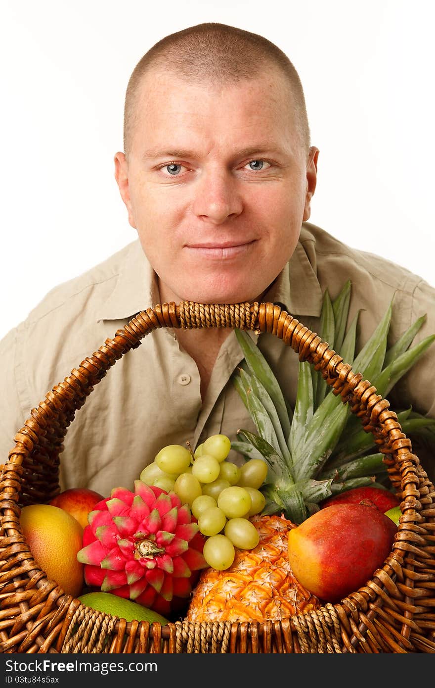 Man with a cane basket of fruit in the mouth. Man with a cane basket of fruit in the mouth