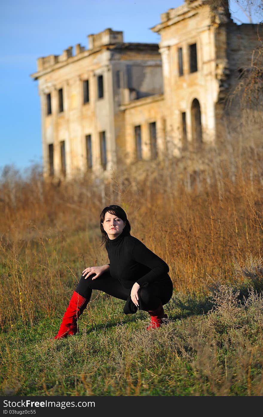 The girl against the old house. The girl against the old house