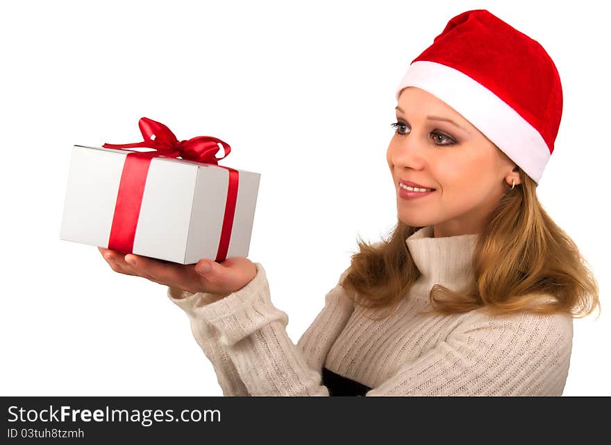 Attractive young girl with Christmas present on a white background