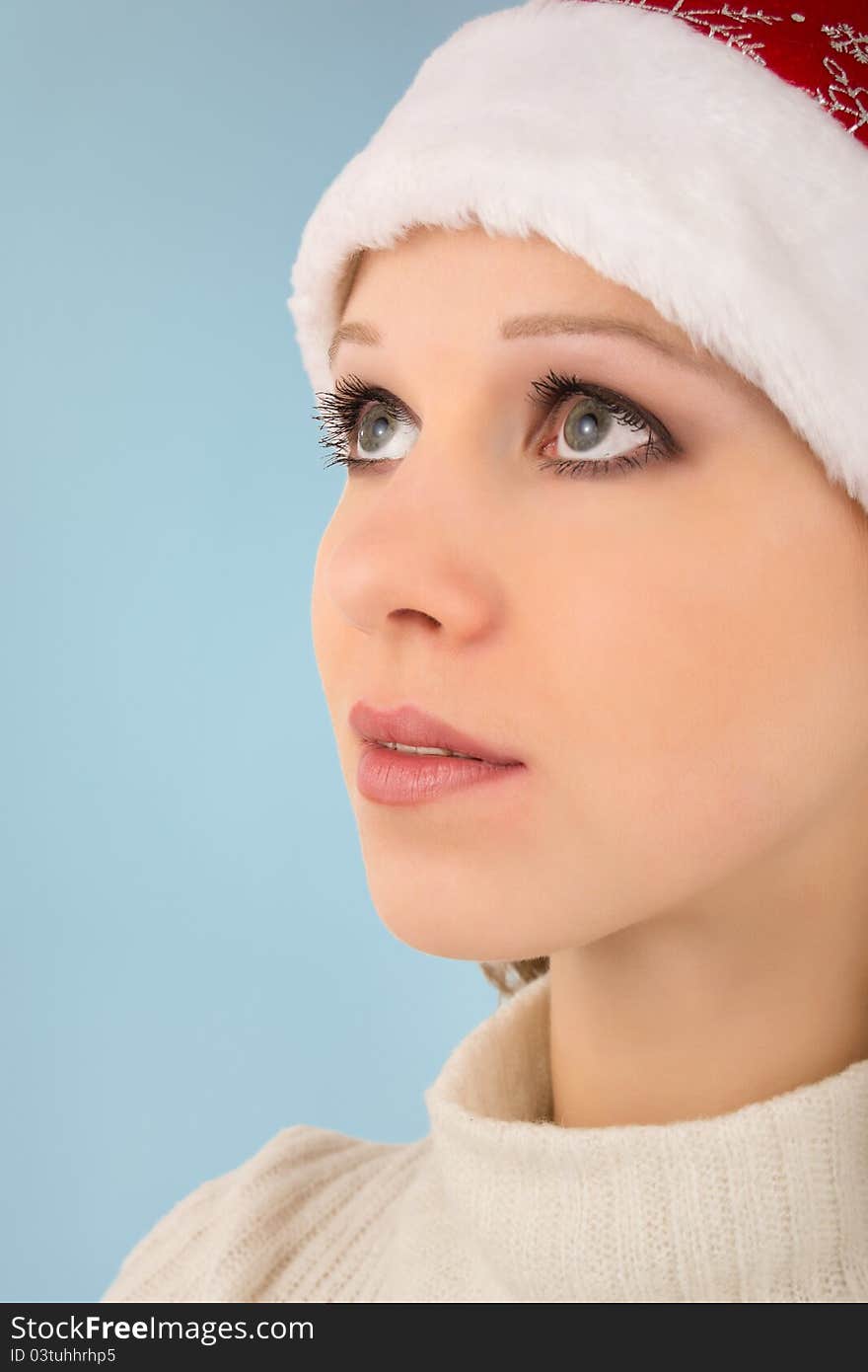 Dreamy look beautiful girl on a blue background