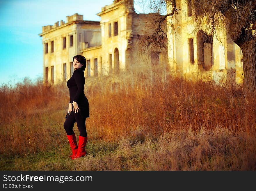 The girl against the old house. The girl against the old house