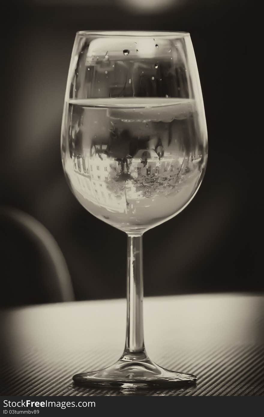 Cocktail glass with reflection of building. Cocktail glass with reflection of building