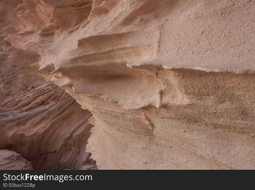 Structure of beautiful rocks on a decline, Pink Rock Face background