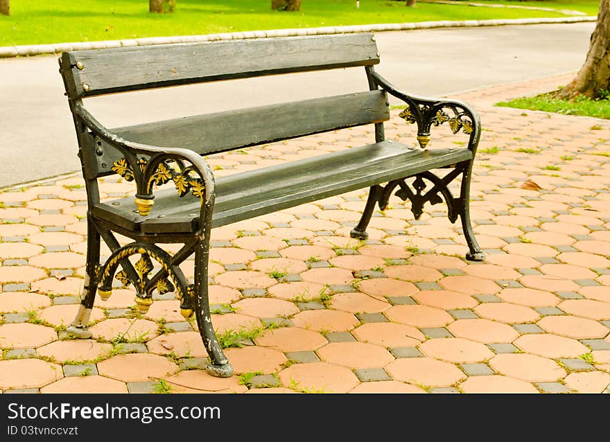 Old arm chair setting in park