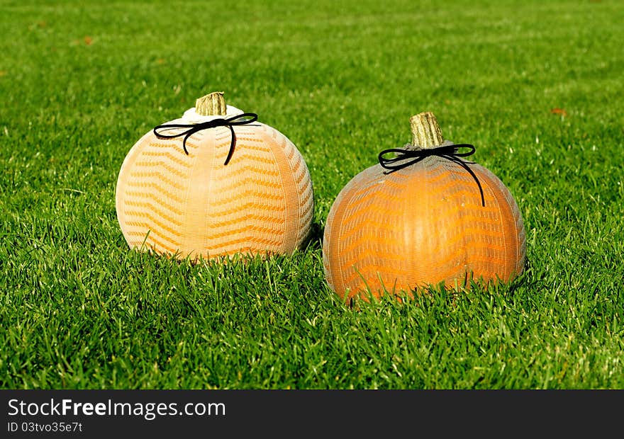 Picture of Halloween pumpkins, standing on a lawn