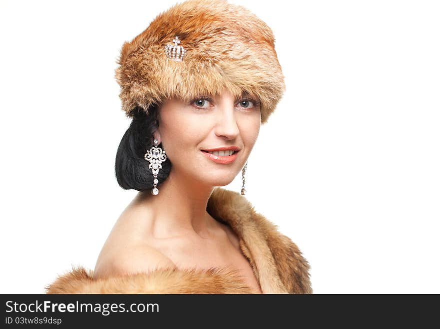 Smiling mature woman in fur isolated on white