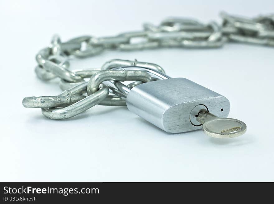 Open padlock and chains on white background.