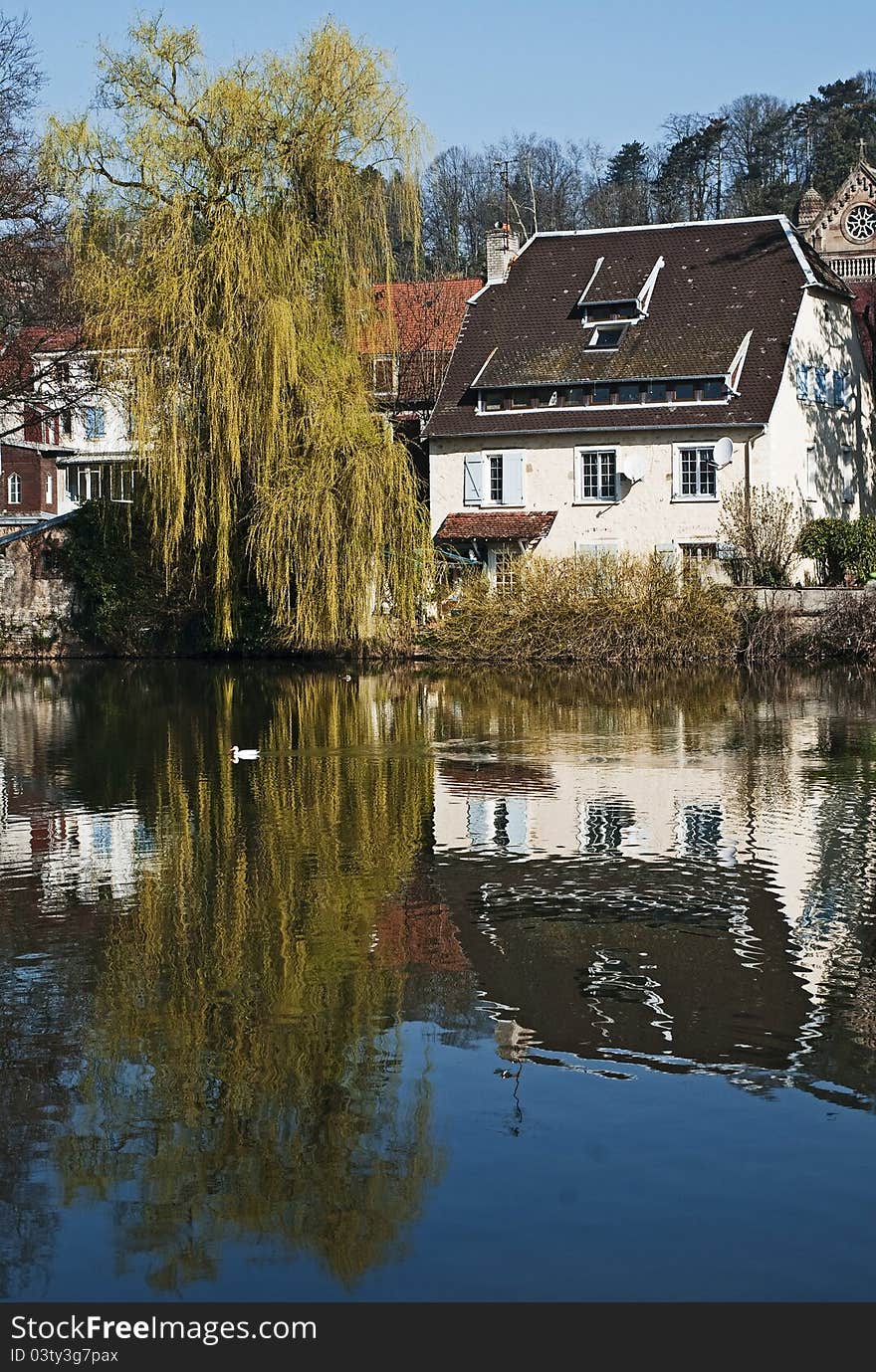 The city of Montbeliard, France. Reflection in the river. The city of Montbeliard, France. Reflection in the river.