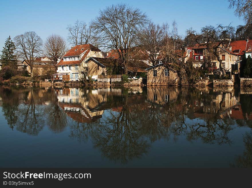 The city of Montbeliard, France. Reflection in the river. The city of Montbeliard, France. Reflection in the river.