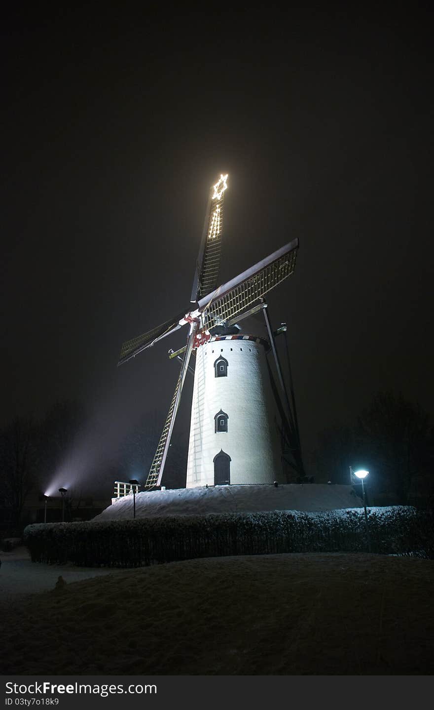 Mill by night with lightened star