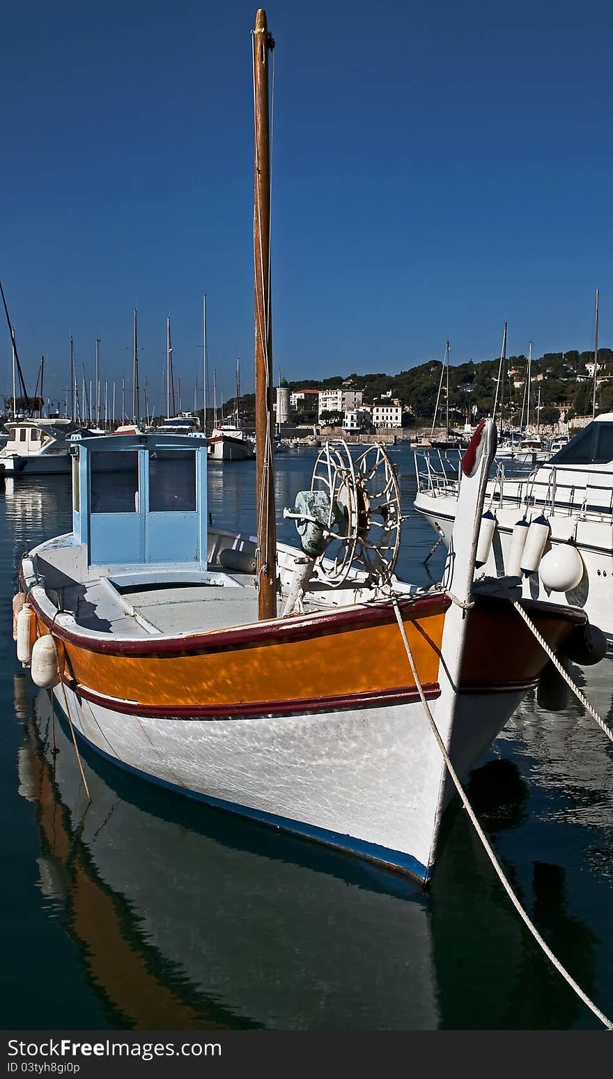 Fishing boat at its moorings in the port of Cassis, south-east of France. Fishing boat at its moorings in the port of Cassis, south-east of France.